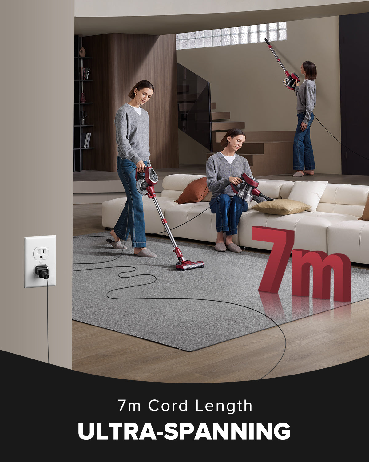 Two people using a vacuum cleaner with a 7m cord in a living room setting.