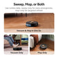 Robotic vacuum cleaner with text explaining its functions on a wooden floor.